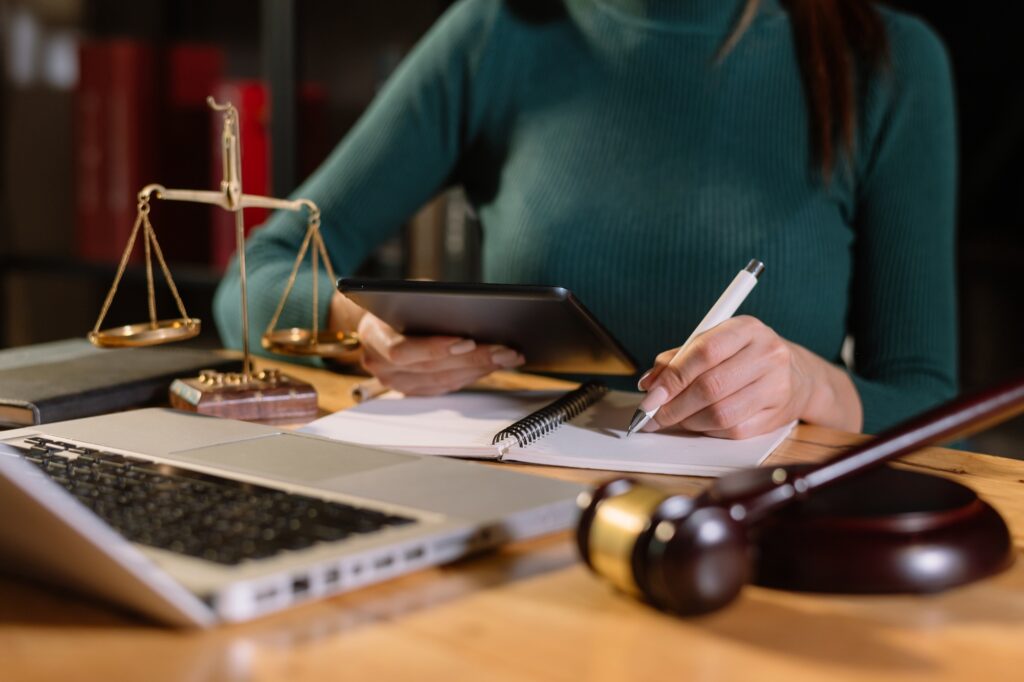 Justice and law concept.Male judge in a courtroom with the gavel, working